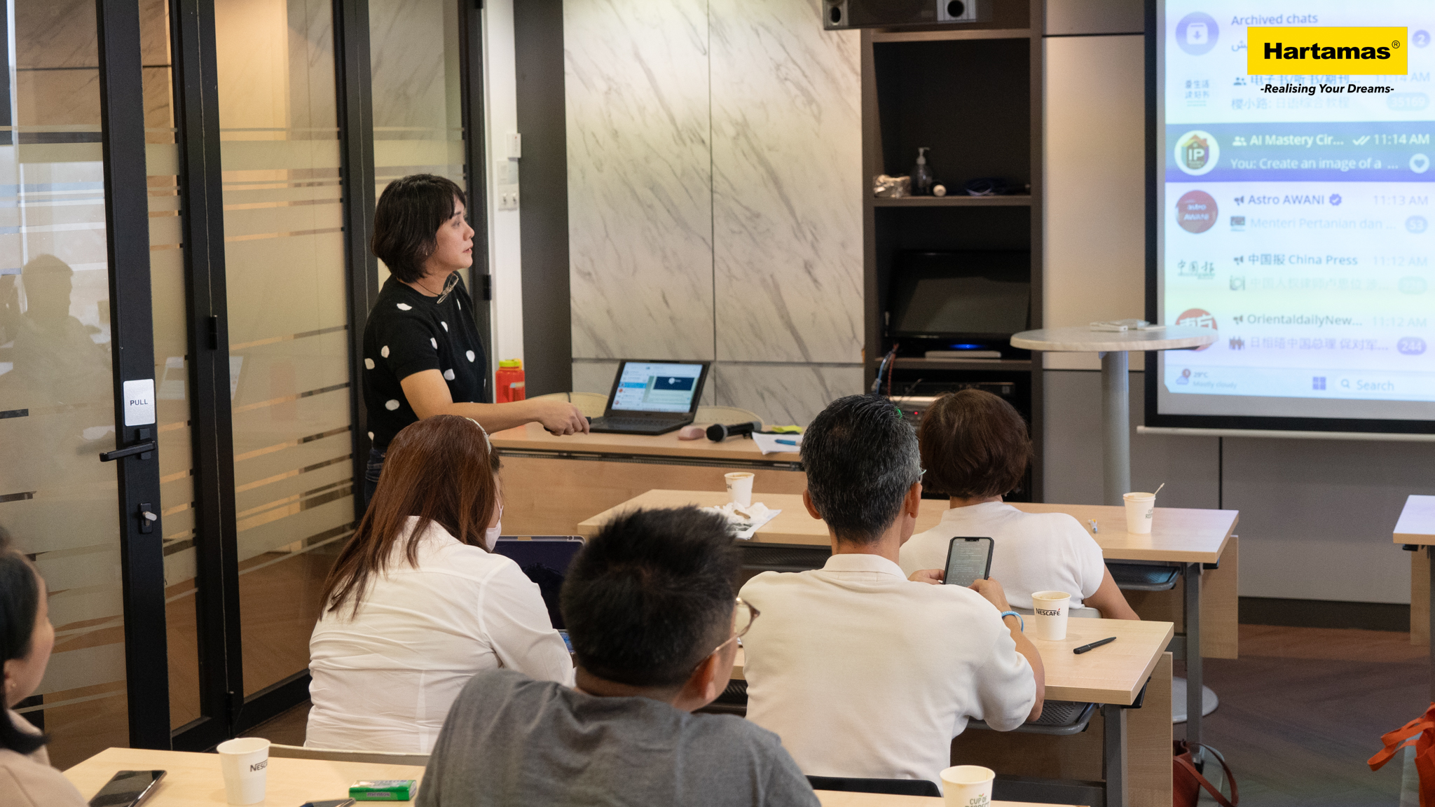 Reese Tan presenting at training